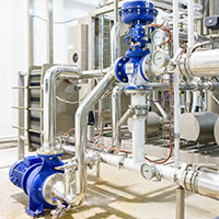 industrial manufacturing equipment with pump and plate heat exchanger